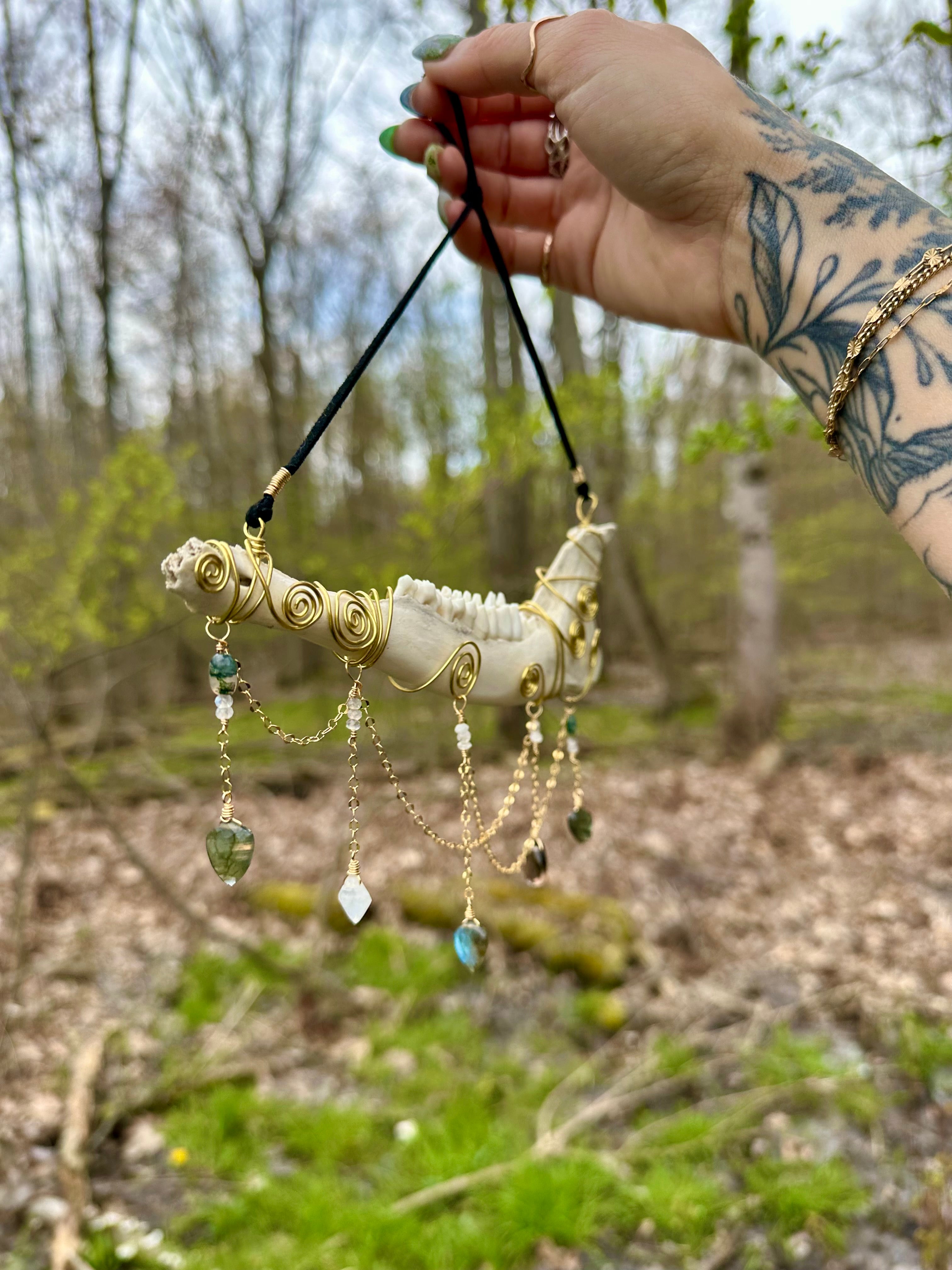 crystal adorned deer bone