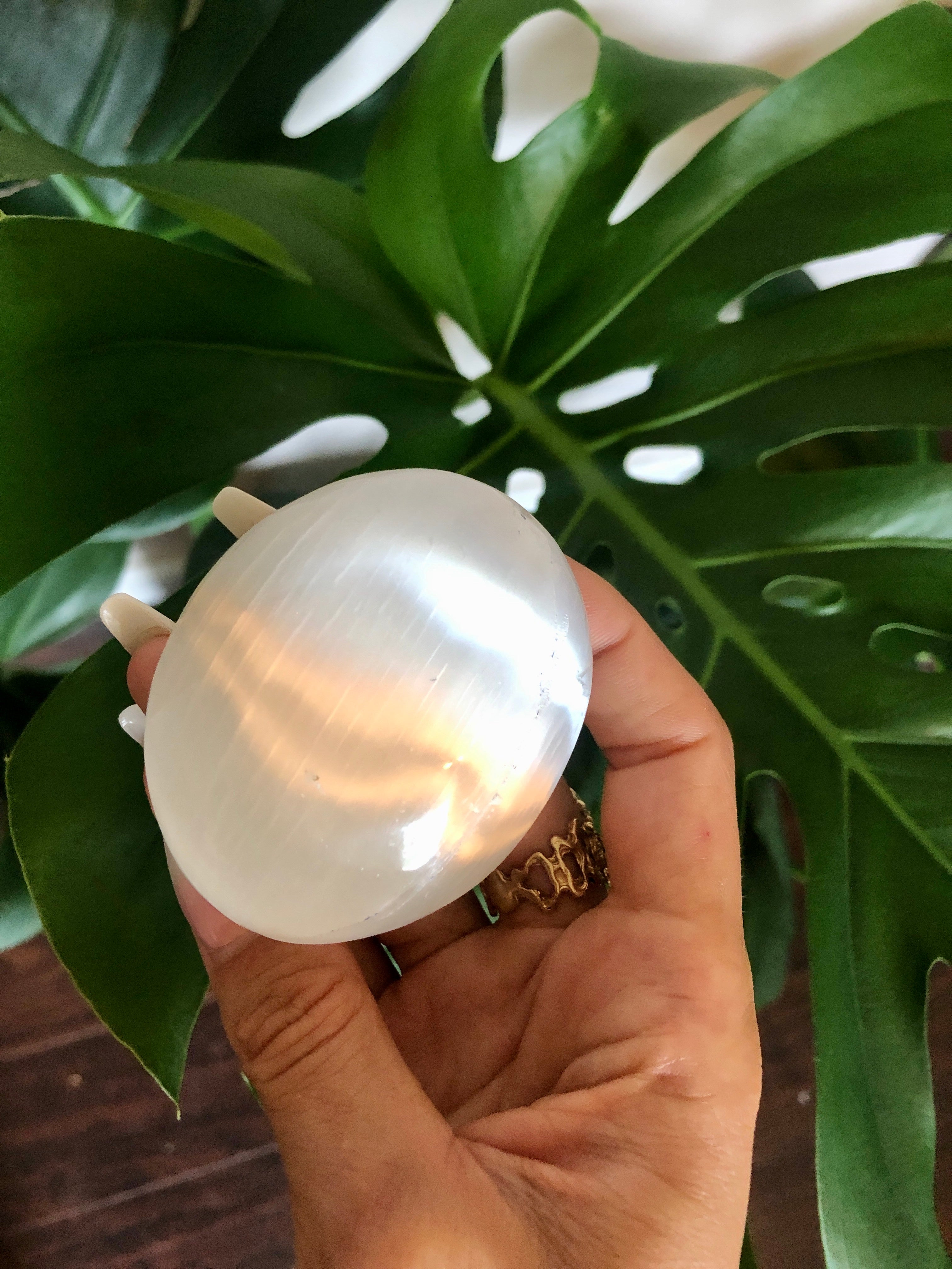 selenite crystal palm stone