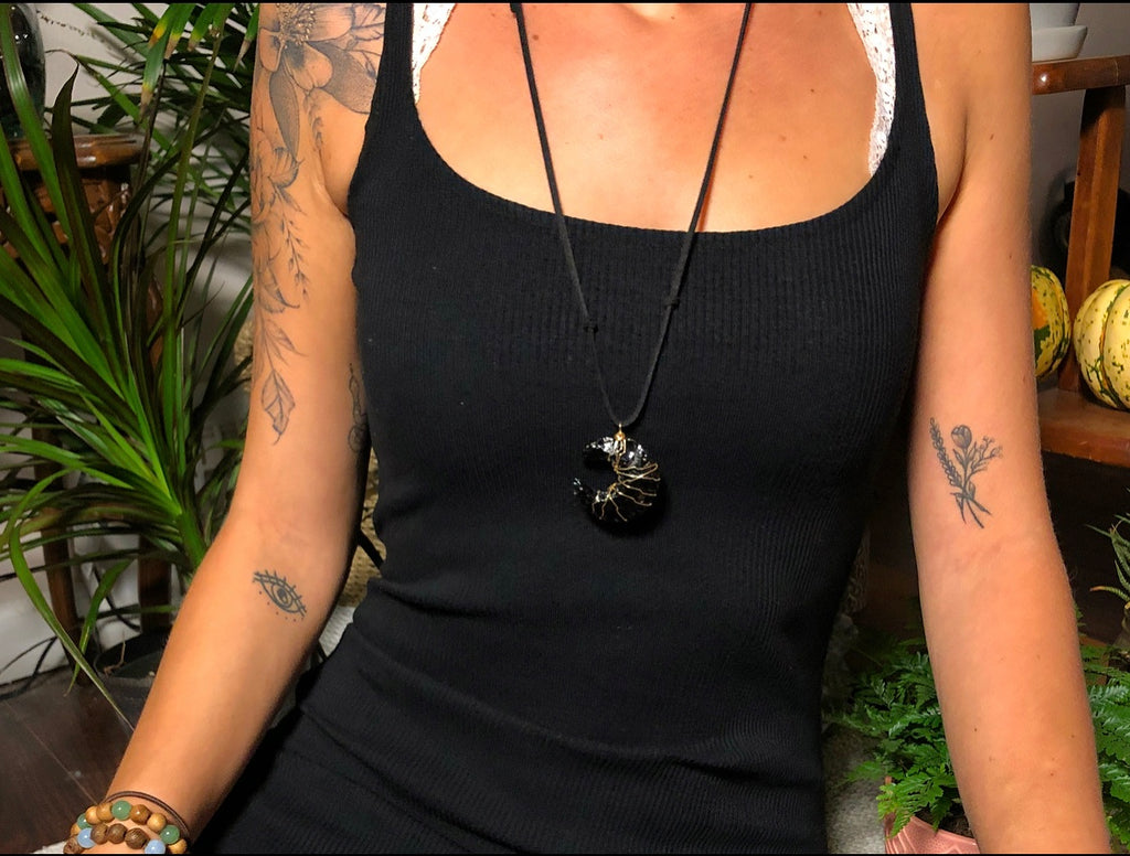grand obsidian moon necklace on vegan suede
