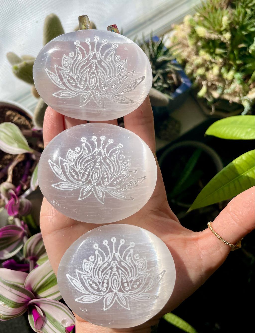 engraved lotus selenite palm stone